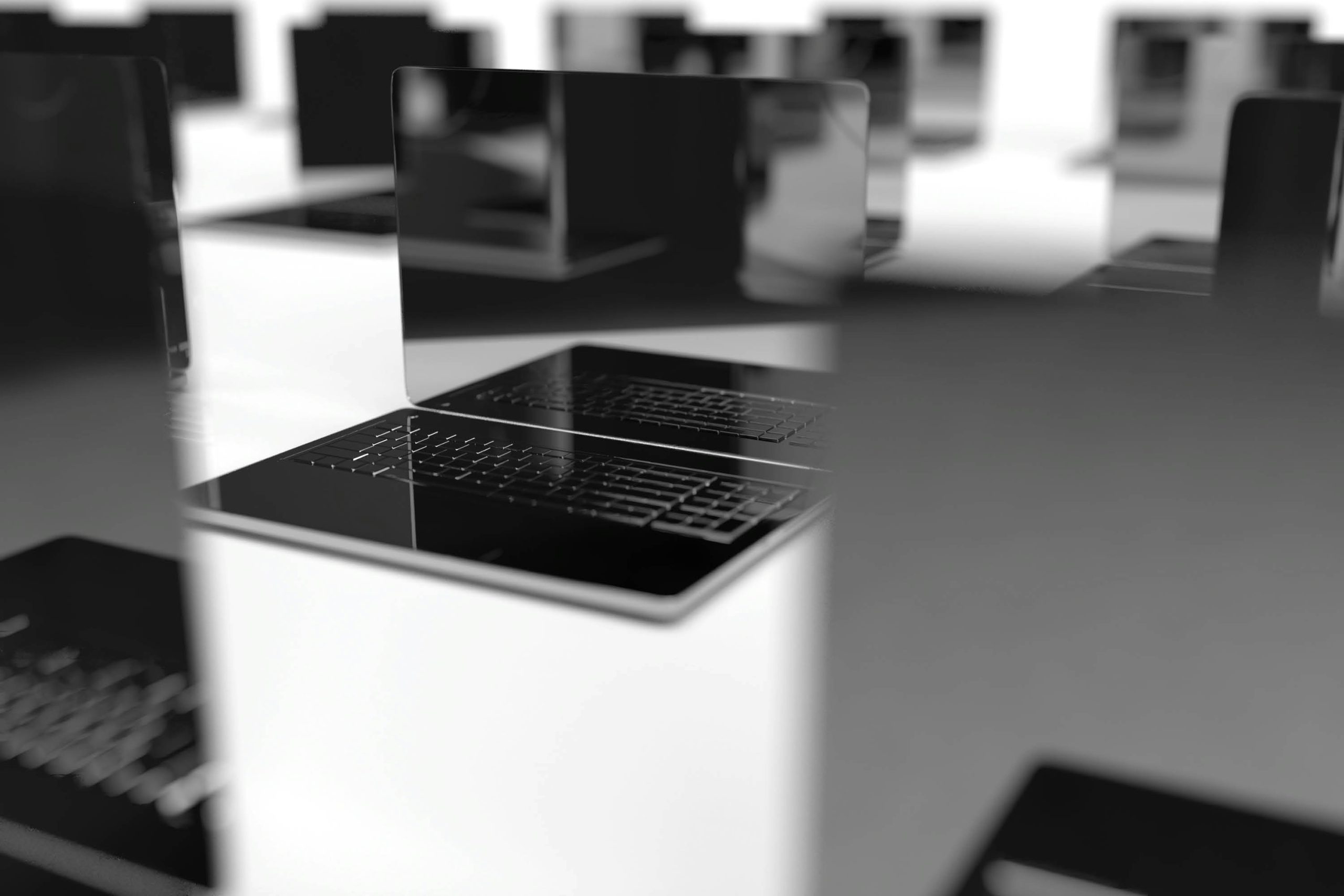 Monochrome laptops representing website infrastructure
